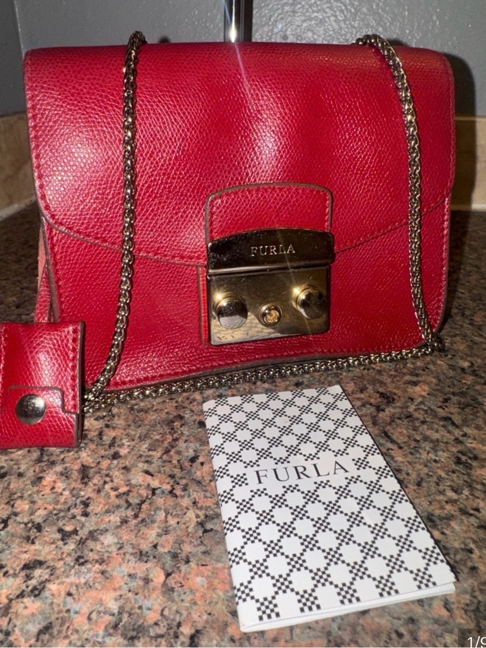 Furla Metropolitan Rare Ruby Red Pebbled Leather Crossbody with Gold Chain. COA
